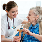 Senior woman is visited  by her doctor or caregive